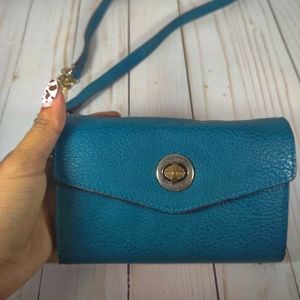 Slightly used small blue crossbody shoulder bag with clasp